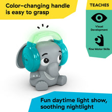 Elephant sound machine with color-changing handle and teal headphones