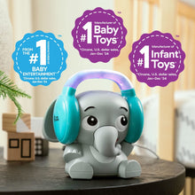 Elephant Bluetooth sound machine on a round stand with teal headphones