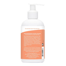 Back view of sweet orange baby lotion bottle with pump dispenser