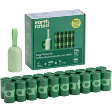 Dog waste kit with dispenser and roll refills, green bags, lavender-labeled packaging