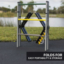 Portable steel ladderball set folded with dark boards and yellow/green balls on feet