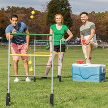 Ladderball set with green and yellow balls as family plays on lawn