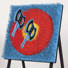 Close-up of blue woven target board on stand with red bullseye