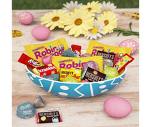 Bowl filled with assorted Easter chocolate mini bars and colorful candy eggs