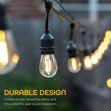 Hanging warm clear LED bulb on black café string light, other bulbs behind