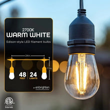 Warm clear LED bulb on black café string light cord, single hanging bulb