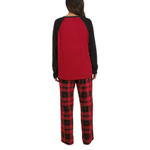 Back view: red raglan pajama top with black sleeves and plaid pajama pants