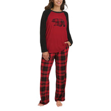 Red raglan pajama top with black sleeves and black-red plaid pajama pants