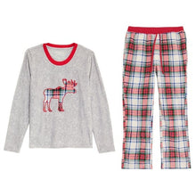 Grey pajama top and plaid pants with red elastic waistband and moose graphic