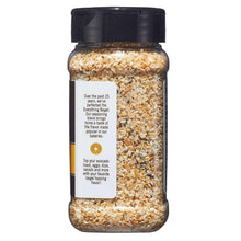 Everything bagel seasoning bottle with back label and speckled seasoning filling