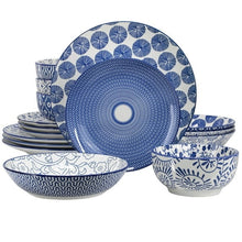 Blue porcelain dinnerware set with patterned plates and bowls, assorted stack