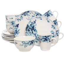 Floral dinnerware set: white plates, blue rose mugs, and bowls