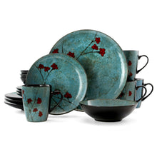 Blue dinnerware set with red floral accents: dinner plates, bowls, and mugs