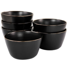 Matt black stoneware bowl set, thin gold rim; stacked bowls