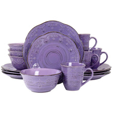 Purple stoneware dinnerware set with embossed circular patterns, plates and bowls in view