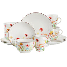 White stoneware dinnerware set with wildflower plates, bowls, and mugs in red and blue