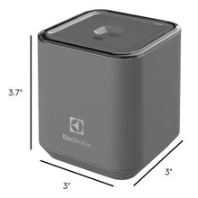 Gray handheld vacuum sealer pump with dimensions 3 x 3 x 3.7 in.