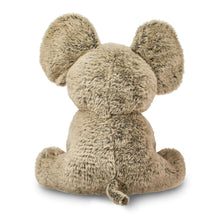 Gray plush elephant toy from side view, seated with soft fur and rounded ears.