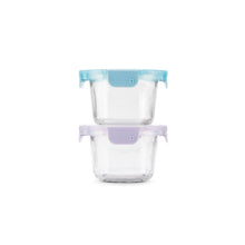 Single clear glass food storage container with blue lid on purple base