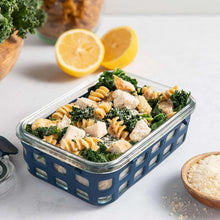 Glass food storage container with snap lid filled with pasta and broccoli