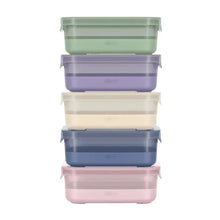 Plastic meal prep storage containers with matching snap lids, stacked in pastel colors