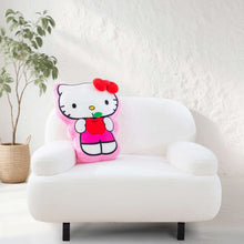 Hello Kitty cloud plush pillow with red bow, sitting on a white chair cushion.