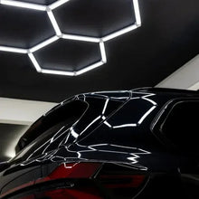 Hex ceiling light panels casting bright white light