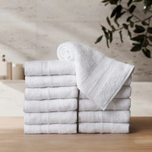 White hand towel set, 12-pack, neatly folded with rolled towel on top