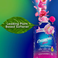 Blue fabric softener bottle with pink flowers and leaf graphic, plant based claim