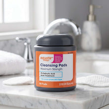 Cleansing pads jar with dark lid and orange label showing 90 pads