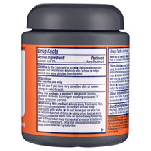 Cleansing pads jar with dark lid and orange drug facts label panel