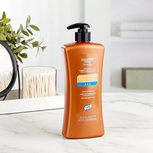 Equate Beauty cocoa conditioning lotion bottle with pump, front view, 20.3 fl oz