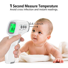 Non-contact infrared forehead thermometer held near baby, green body temperature on LCD