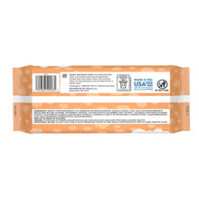 Back of orange baby wipes package with barcode, claims, and made in USA