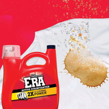 Laundry detergent jug beside stained white fabric with visible dirt spots