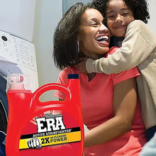 Laundry detergent jug foreground next to two people in a laundry room
