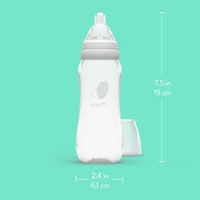 Clear standard-neck baby bottle with nipple and white measuring base