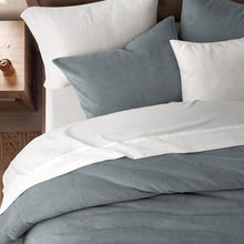 Blue mini waffle plush comforter set with white reverse and coordinating textured pillows