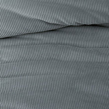 Mini waffle plush comforter fabric in blue, showing its raised texture