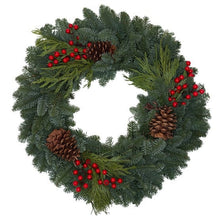 Evergreen wreath with fir foliage, red berries, cedar sprigs, and pine cones