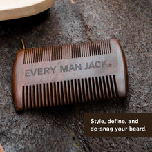Ebony wood beard comb close-up with fine and wide teeth