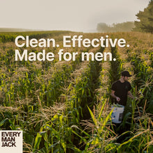 Man walking through tall grass holding a bucket, outdoor-themed clean text
