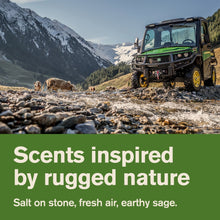 John Deere utility tractor in mountainous landscape with rugged outdoor styling text