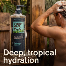 Every Man Jack moisturizing shampoo bottle with dark pump, Caribbean Coconut, held outdoors