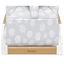 Light gray bouncer with cloud-print breathable cushion and evolur wood base