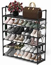 Expandable 6-tier shoe organizer with bronze frame, holding multiple pairs and bags