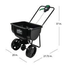 Push broadcast spreader with black hopper and wheels; dimensions shown in inches
