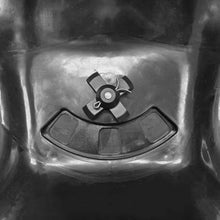 Black spreader base with central spinner plate and small mounting hardware