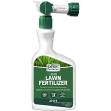 Liquid lawn fertilizer bottle with sprayer top, green-and-white label showing 22-0-3