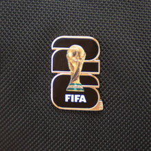 Black fabric with FIFA trophy badge pin in gold and blue trim